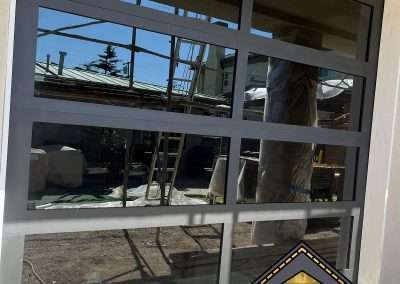 This New Contemporary Glass Aluminum Garage Door was installed in Dana Point Ca by Golden Rule Garage Door Inc.
