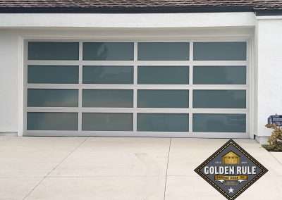 This New Contemporary Glass Aluminum Garage Door was installed in Dana Point Ca by Golden Rule Garage Door Inc.