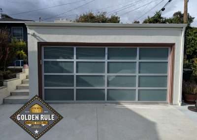 This New Contemporary Glass Aluminum Garage Door was installed in San Clemente Ca by Golden Rule Garage Door Inc.