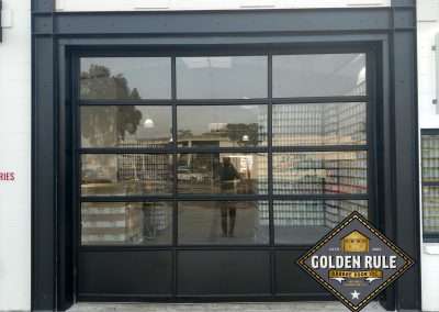 This New Contemporary Glass Aluminum Garage Door was installed in Anaheim Ca by Golden Rule Garage Door Inc.