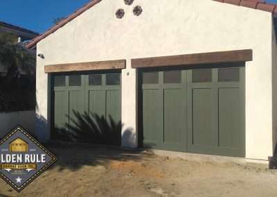New Custom Wood Carriage House Garage Doors installed in San Clemente CA by Golden Rule Garage Door Inc. Spanish Style Paint-grade