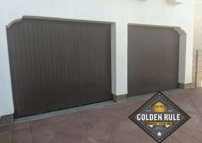 New Custom Wood Carriage House Garage Doors installed in Laguna Beach CA by Golden Rule Garage Door Inc. Spanish Vertical Plank, Paint-Grade