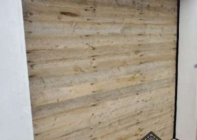 New Custom Wood Carriage House Garage Door installed in Newport Beach CA by Golden Rule Garage Door Inc. Vintage Reclaimed Lumber