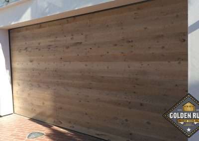 New Custom Wood Carriage House Garage Doors installed in Newport Beach CA by Golden Rule Garage Door Inc. Vintage Reclaimed Lumber