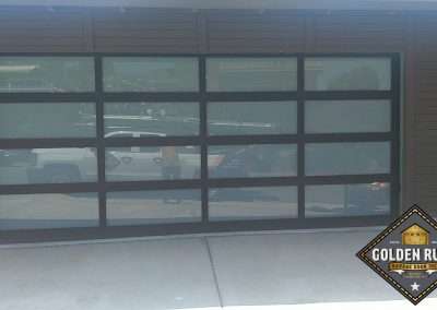 This New Contemporary Glass Aluminum Garage Door was installed in Dana Point Ca by Golden Rule Garage Door Inc.