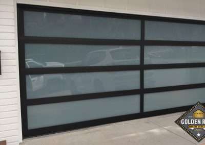 This New Contemporary Glass Aluminum Garage Door was installed in Laguna Niguel Ca by Golden Rule Garage Door Inc.