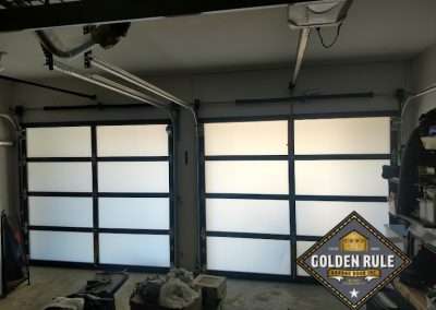 This New Contemporary Glass Aluminum Garage Door was installed in Dana Point Ca by Golden Rule Garage Door Inc.