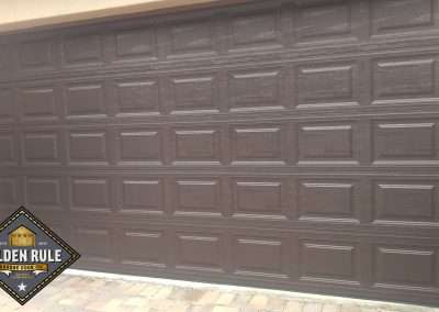 This Unique Traditional Short Panel New Garage Door in Brown was installed in Orange County CA by Golden Rule Garage Door Inc.