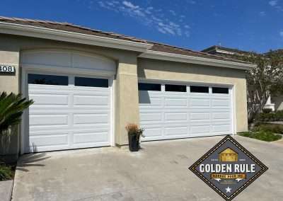 These Insulated Poly-back Unique Traditional Long Panel New Garage Doors in White with L100 windows with 8 R-value were installed in San Clemente CA by Golden Rule Garage Door Inc.