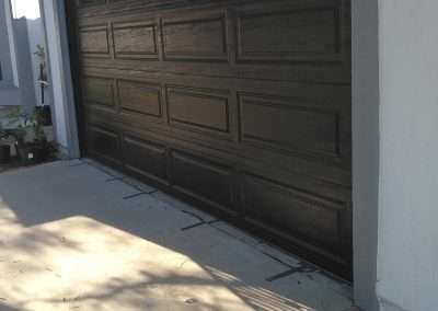 This Unique Traditional Long Panel New Garage Door in Black was installed in Orange County CA by Golden Rule Garage Door Inc.