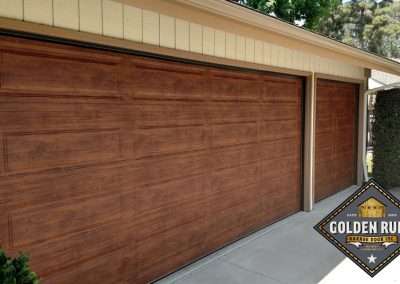 These 3-Layer Steel-back Unique Traditional Long Panel New Garage Doors in Light Finish Wood-Like with 10 R-value were installed in San Juan Capistrano CA by Golden Rule Garage Door Inc.