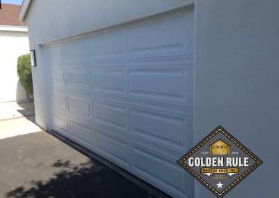 This Unique Traditional Long Panel New Garage Door in White was installed in Orange County CA by Golden Rule Garage Door Inc.