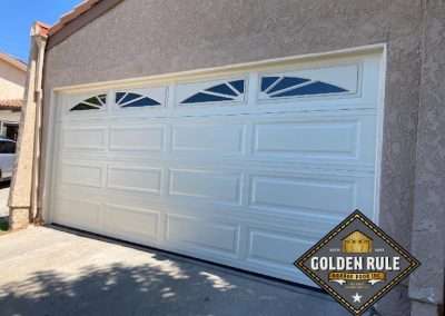 This Unique Traditional Long Panel New Garage Door in White with L305 windows was installed in Orange County CA by Golden Rule Garage Door Inc.