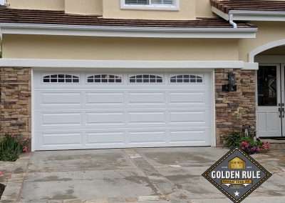 This Unique Traditional Long Panel New Garage Door in White with L399 windows was installed in Orange County CA by Golden Rule Garage Door Inc.