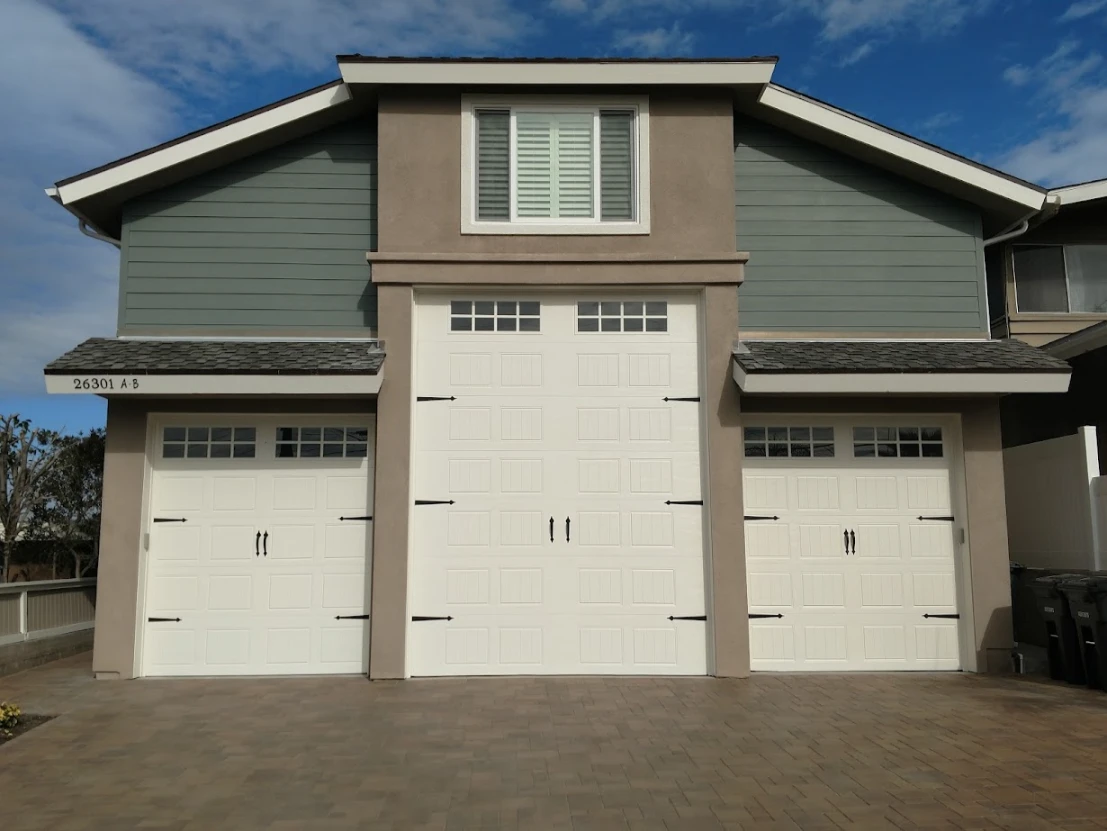 Two-story home with a double garage and concrete driveway